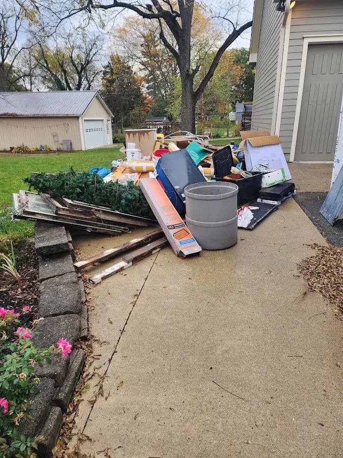 Dumpster being loaded with debris for Demolition Dumpster Rental in Lake Shore